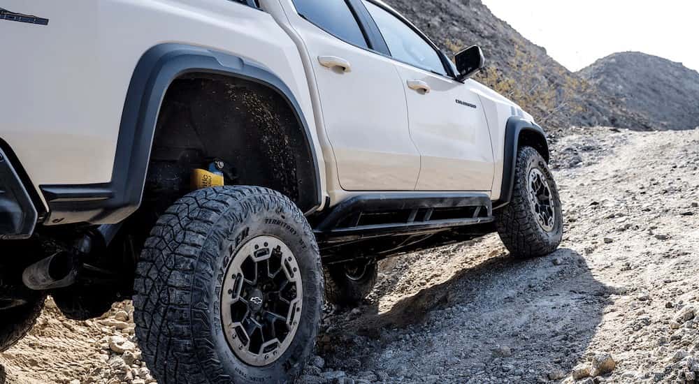 Close-up of a rear wheel in a white 2025 Chevy Colorado Trail Boss.