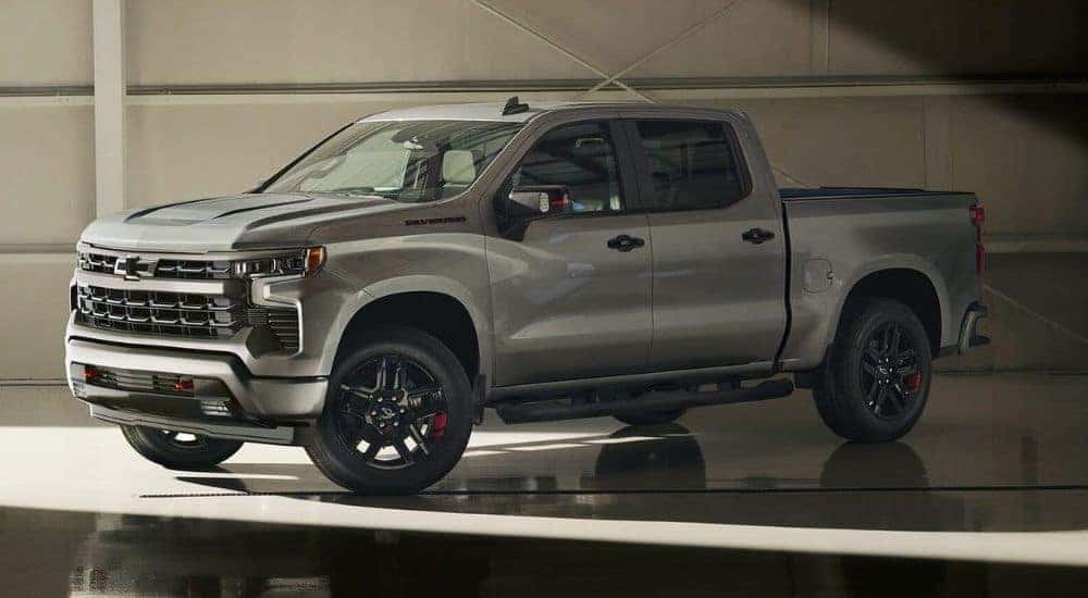 Grey 2025 Chevy Silverado 1500 Redline parked in a showroom.