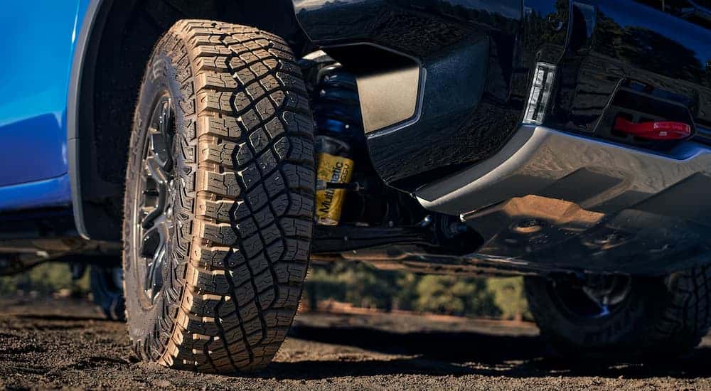 Close up on the wheels of a blue 2025 Chevy Silverado 1500 ZR2.