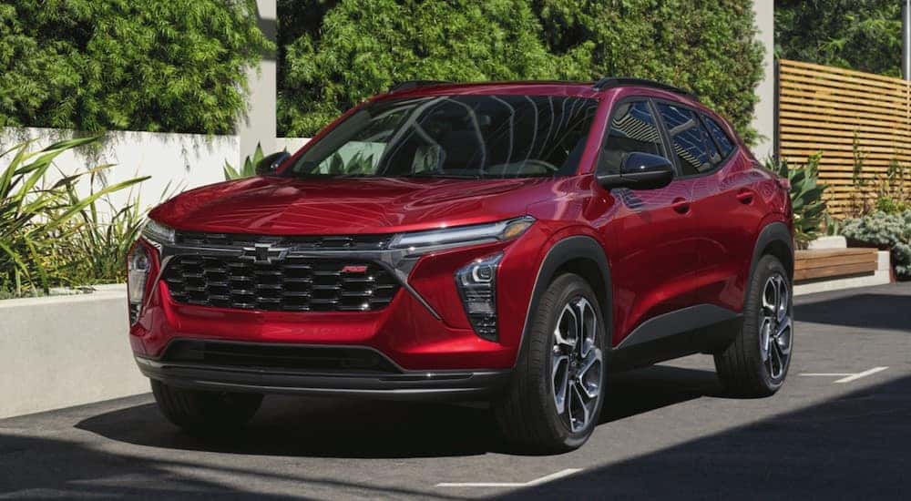 A red 2025 Chevy Trax RS parked on a parking spot.