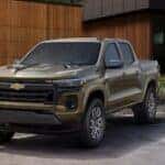 A green 2025 Chevy Colorado for sale parked on a driveway.