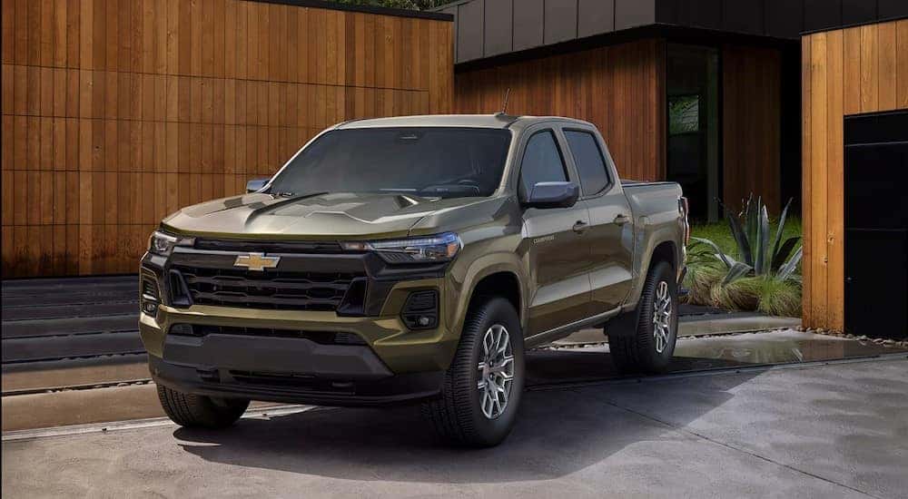 A green 2025 Chevy Colorado for sale parked on a driveway.