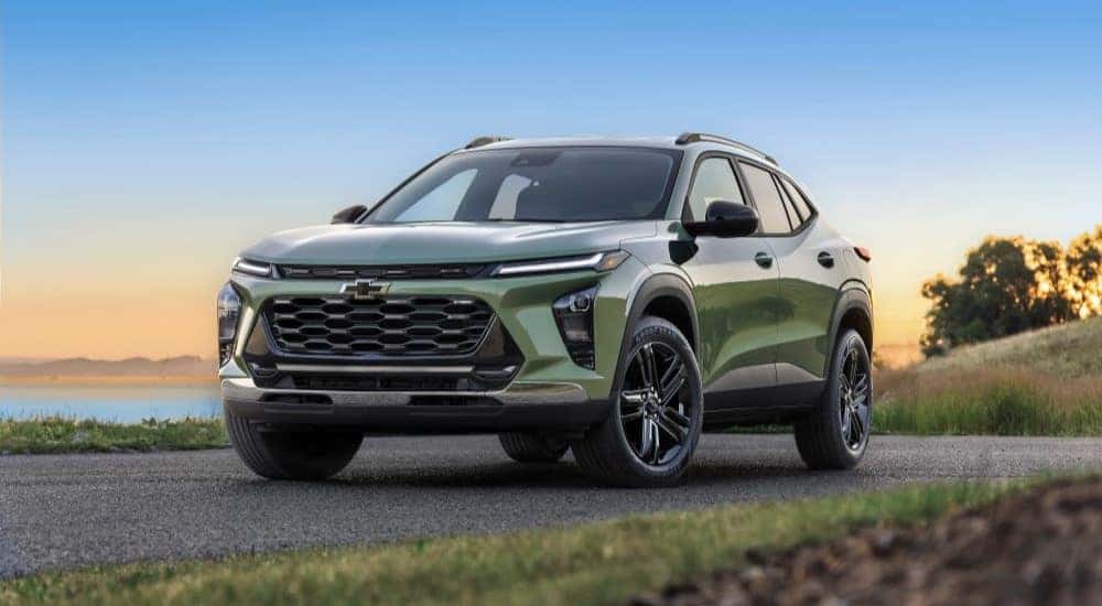 A green 2025 Chevy Trax ACTIV parked on a road