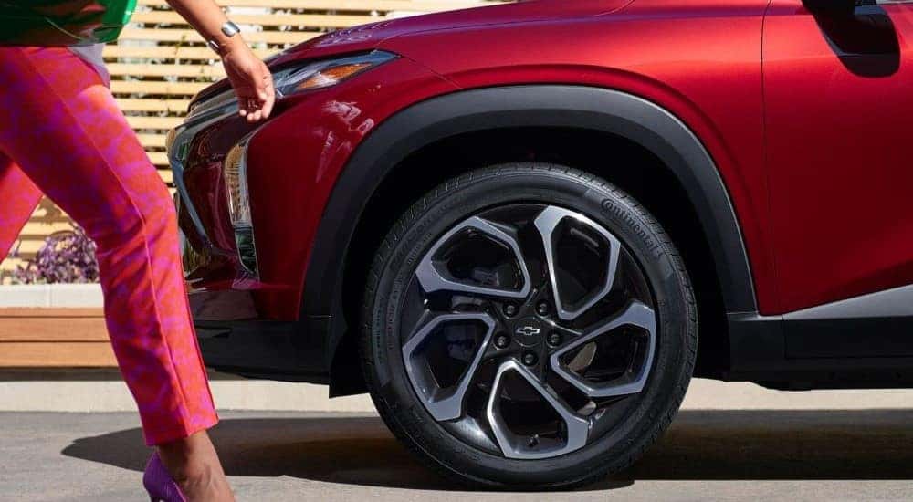 Tire and rim on a red 2025 Chevy Trax RS for sale in Atlanta