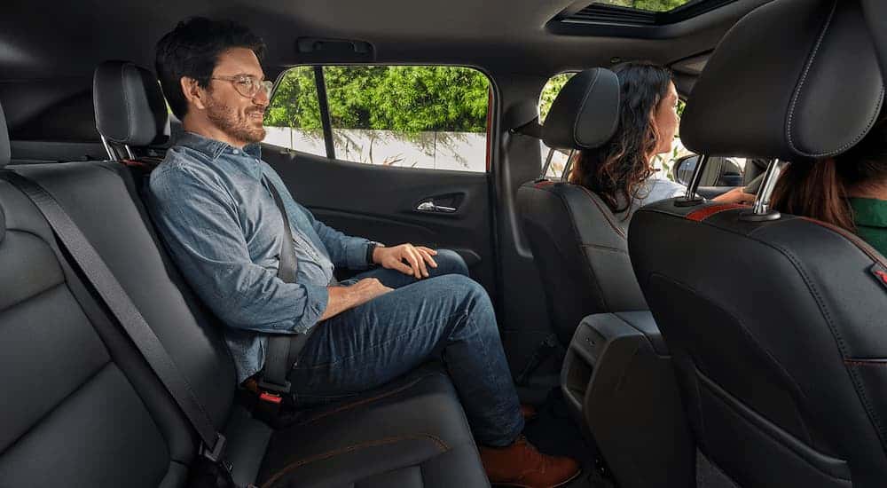Man sitting in the rear seat of a 2025 Chevy Trax 2RS