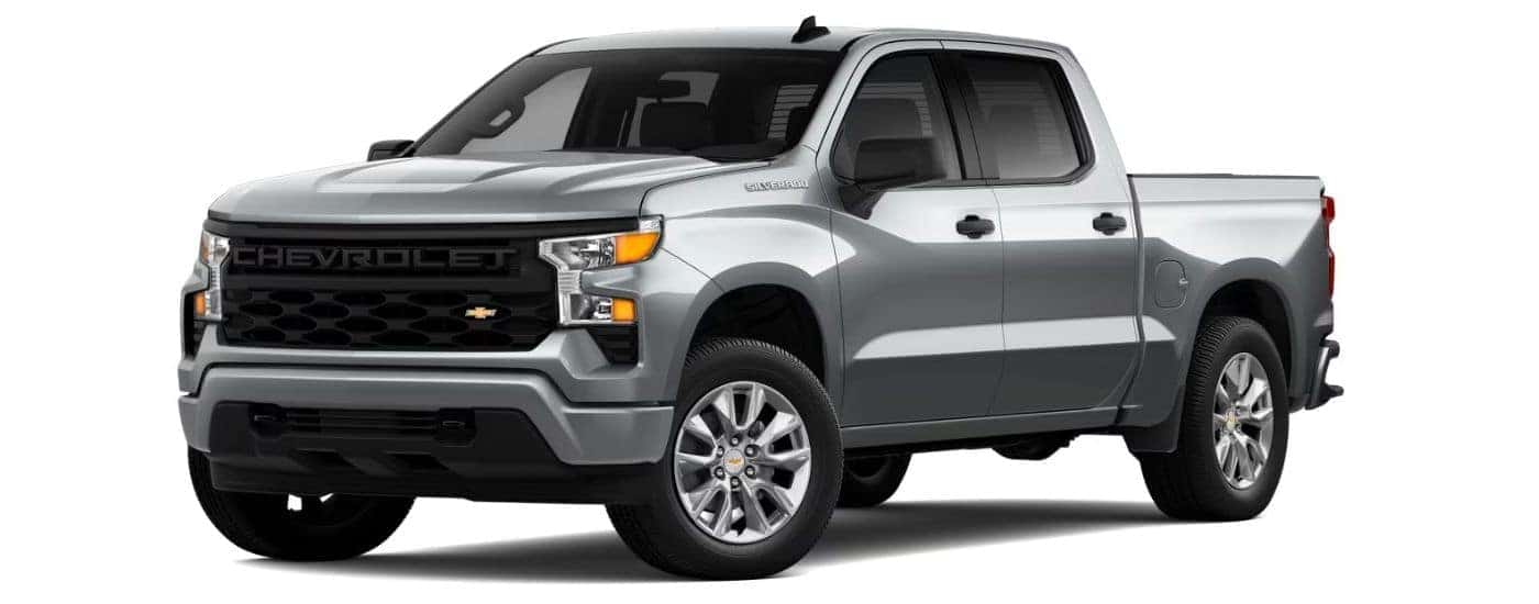 A silver 2023 Chevy Silverado 1500 Custom is angled left.