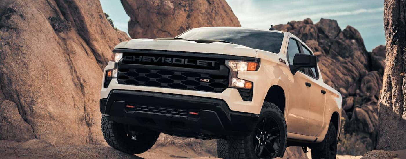 White 2025 Chevy Silverado 1500 Z71 for sale near Alpharetta driving off-road.