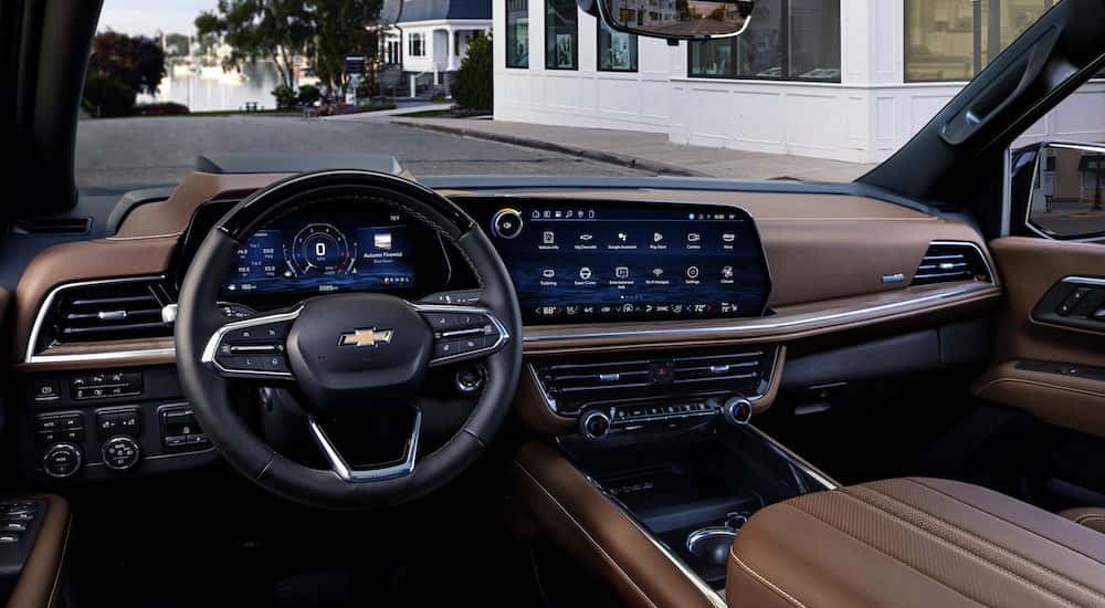 The brown interior of a 2025 Chevy Suburban from the drivers seat.