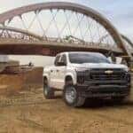 A white 2025 Chevy Colorado WT from the front at an angle.