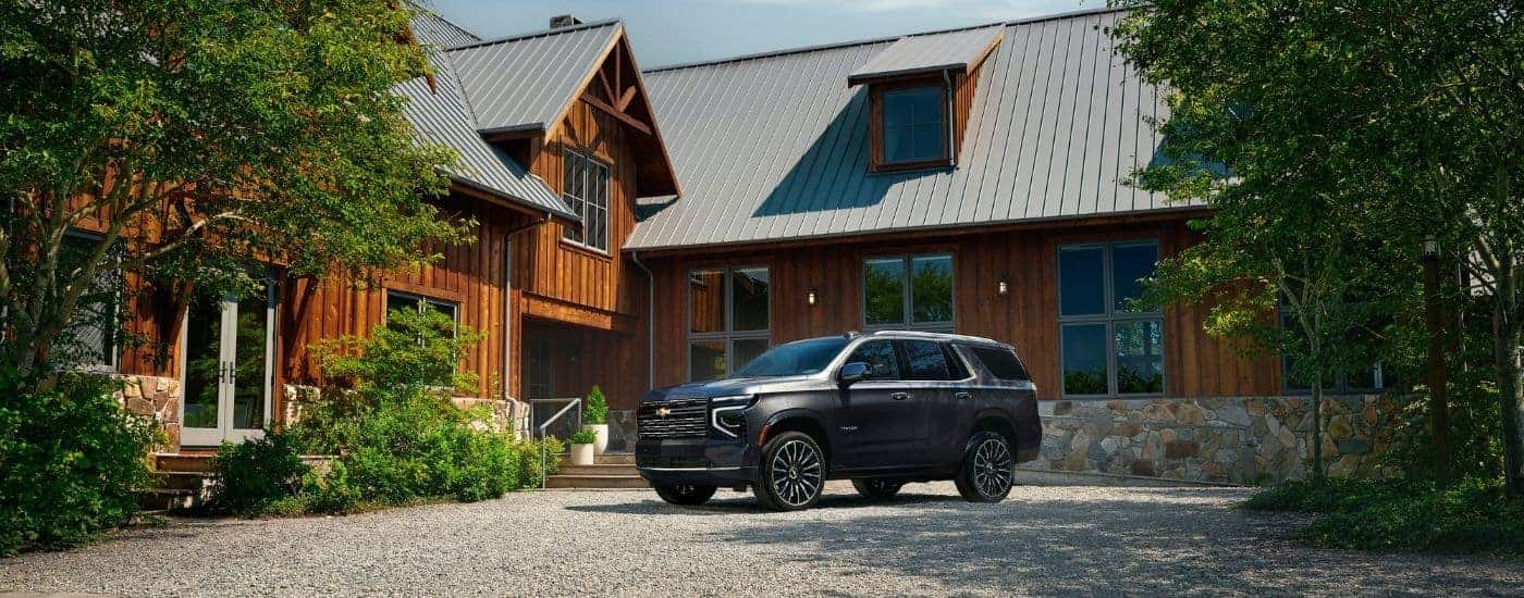 A grey 2025 Chevy Tahoe from the side.