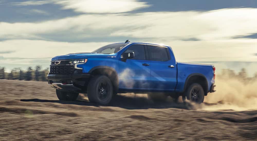Blue 2026 Chevy Silverado 1500 ZR2 driving off-road