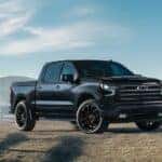 Black 2026 Chevy Silverado 1500 for sale near Duluth parked on a farm