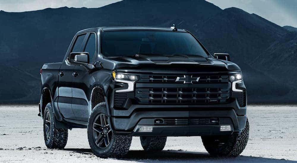 Black 2026 Chevy Silverado 1500 for sale parked off-road.