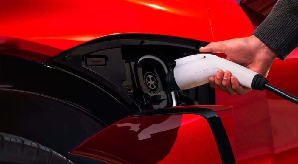 Charging port on a red 2026 Chevy Blazer EV SS.