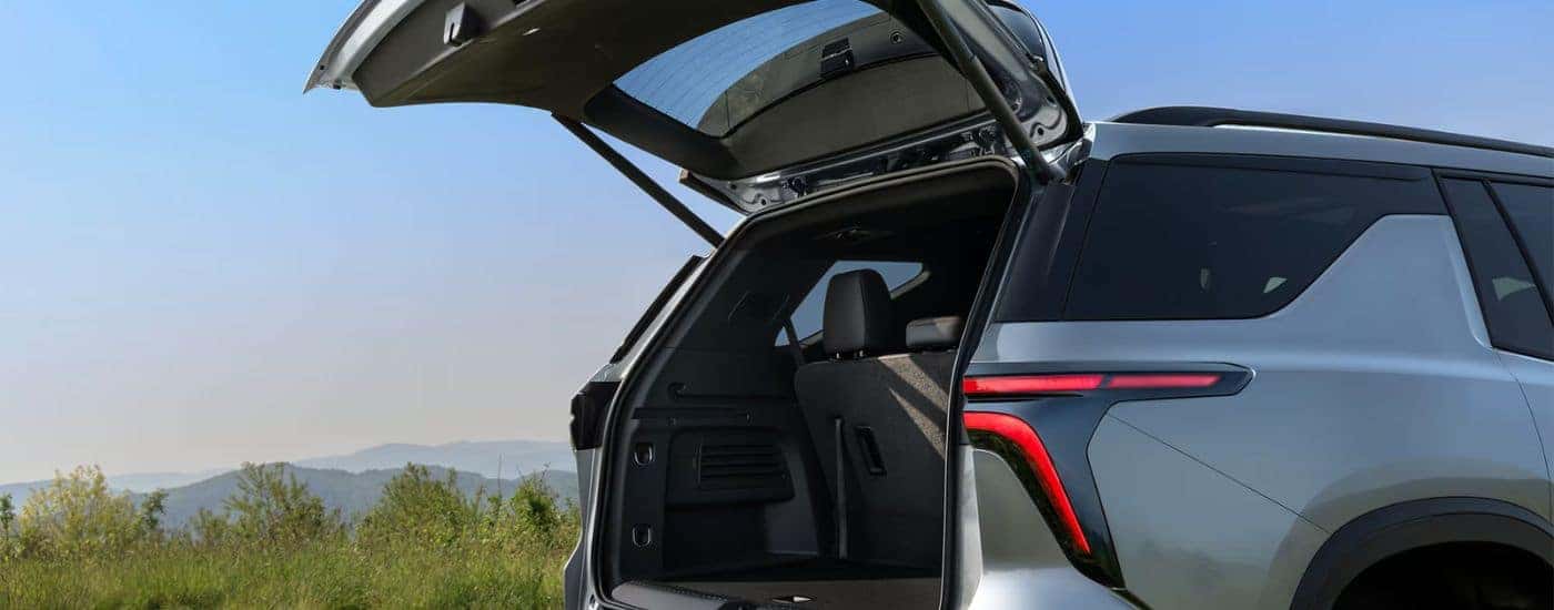 Grey 2026 Chevy Traverse with an open rear liftgate.