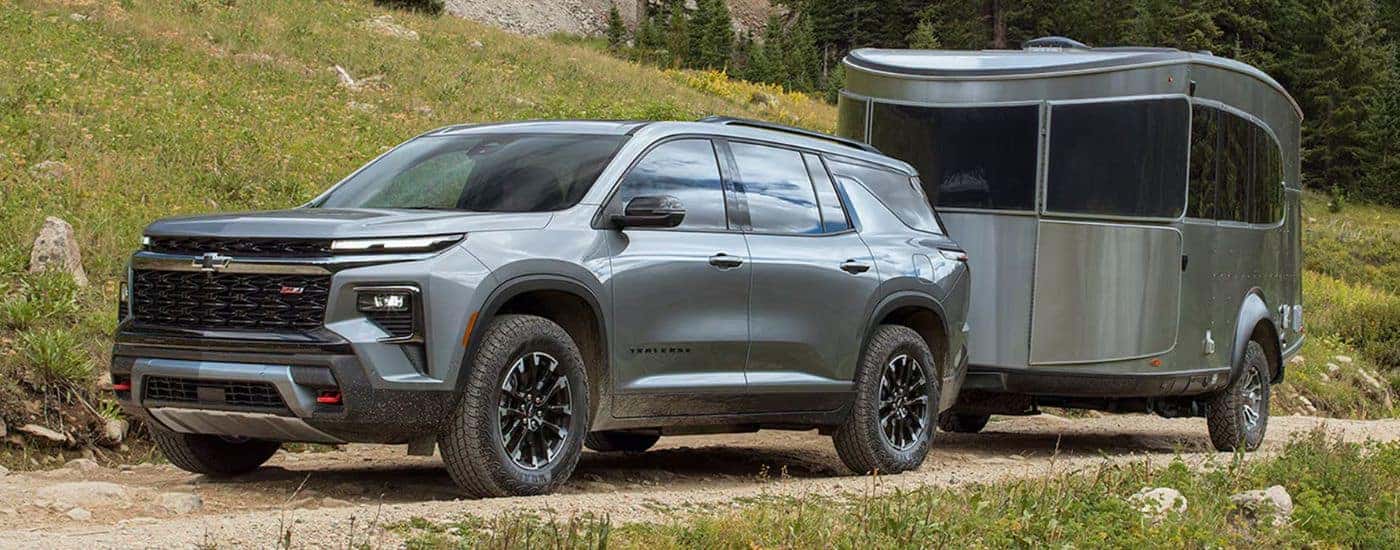A gray 2026 Chevy Traverse Z71 shown towing a trailer.