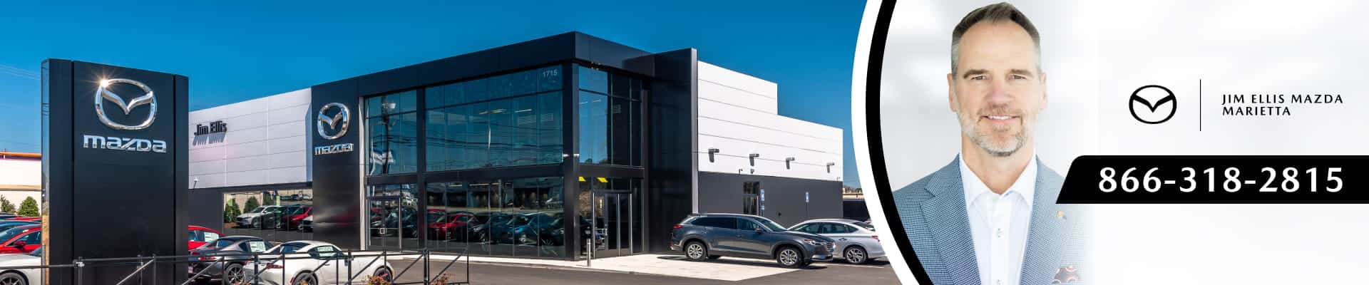 Jim Ellis Mazda dealership exterior alongside a portrait of the general manager, Mazda branding, and contact phone number