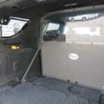 White 2025 Chevy Tahoe law enforcement unit equipped with reinforced push bumper and emergency lighting system.