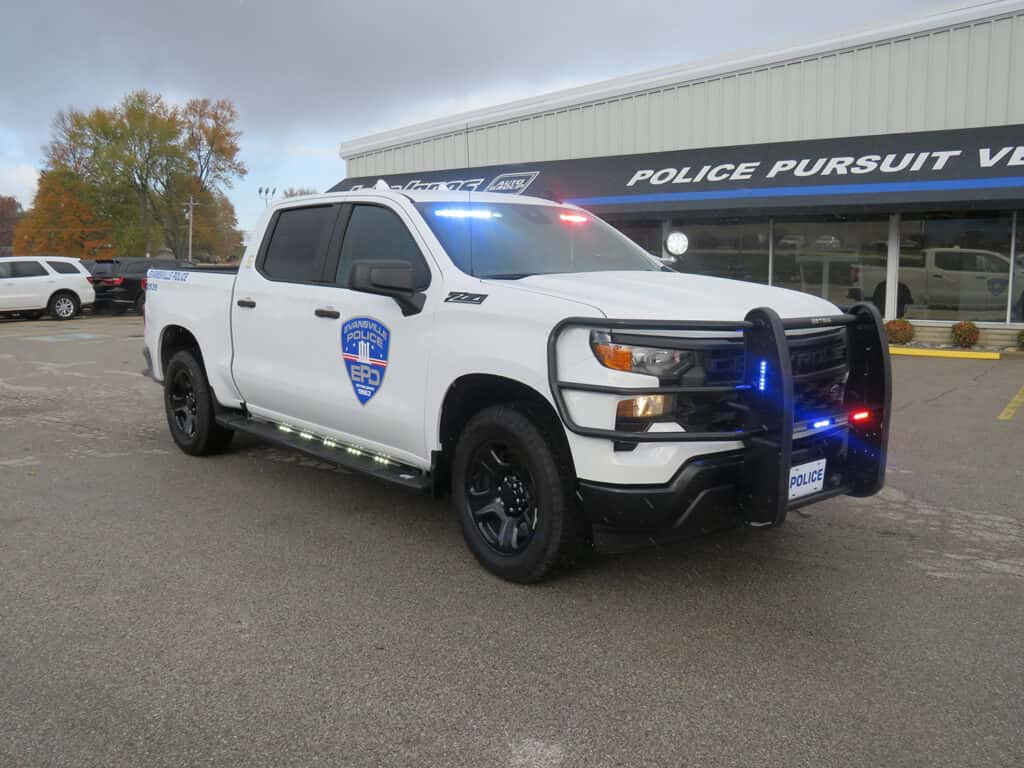 Chevrolet Silverado police truck equipped with roof emergency lights and secure truck bed drawer