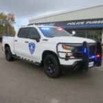 Chevrolet Silverado police truck equipped with roof emergency lights and secure truck bed drawer