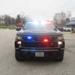 Front view of a Chevrolet Silverado patrol pickup with LED warning lights and utility bed drawers.