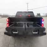 Chevrolet Silverado upfitted for police use with grille lights and heavy-duty slide-out truck bed drawers.