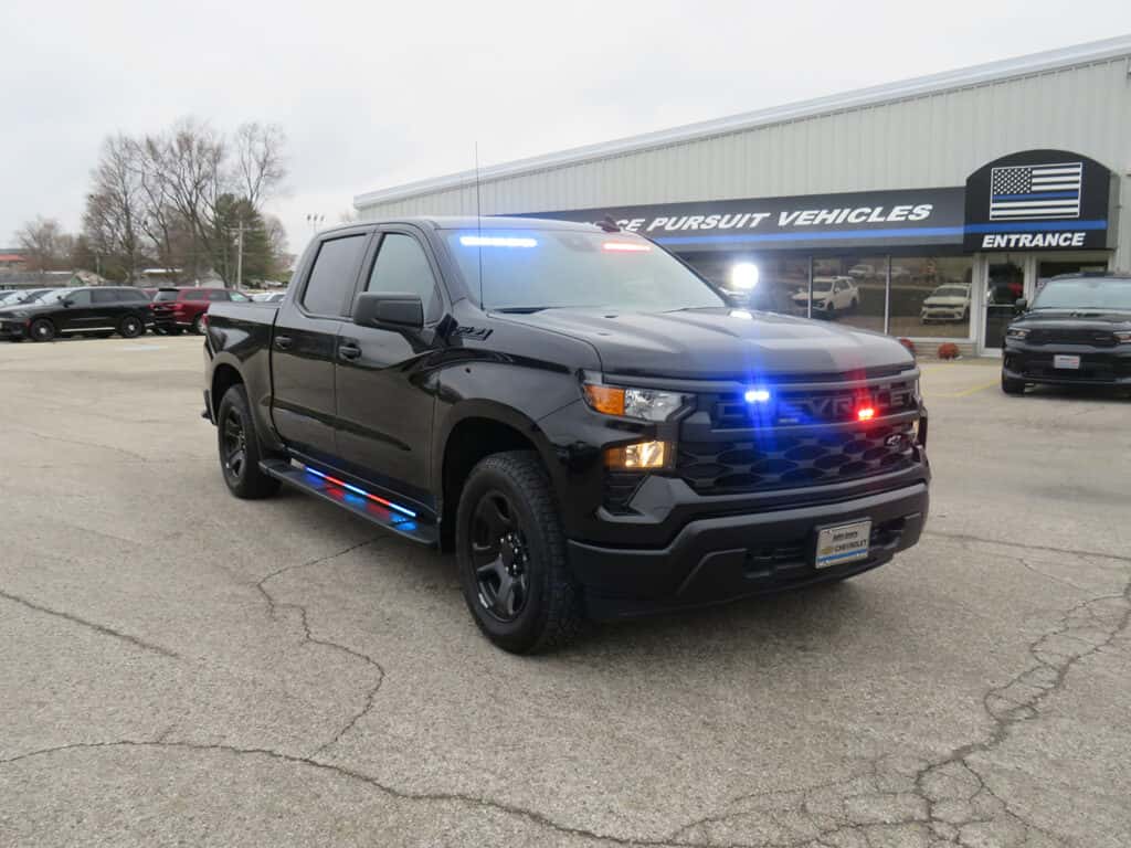 2025 Chevrolet Silverado police truck equipped with roof emergency lights and secure truck bed drawer storage system