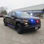 2025 Chevrolet Silverado police truck equipped with roof emergency lights and secure truck bed drawer storage system
