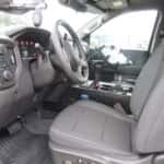 Chevrolet Silverado configured for law enforcement with emergency light package and slide-out cargo drawers.