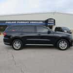 Side profile of a 2025 Dodge Durango upfitted for EMS response, featuring red emergency lights