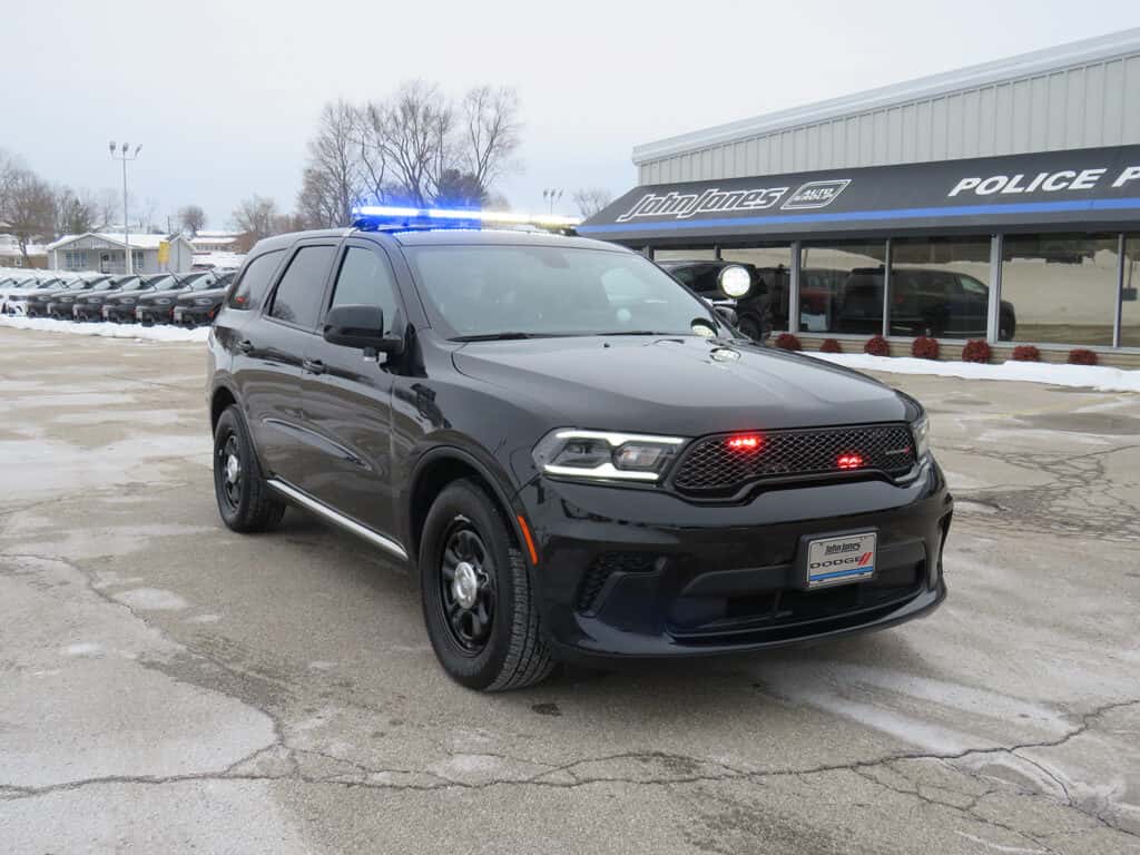 2025 Dodge Durango police SUV upfitted for a New York department with roof light bar and grille warning lights.