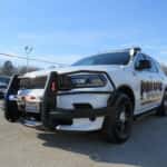 2025 Dodge Durango police SUV equipped with black push bumper and roof-mounted emergency light bar.