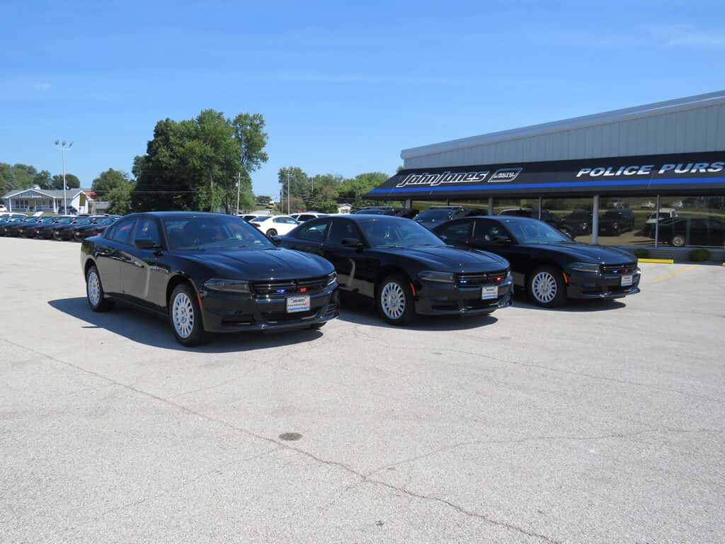 Front three-quarter view of three Dodge Chargers upfitted for School Resource Officers