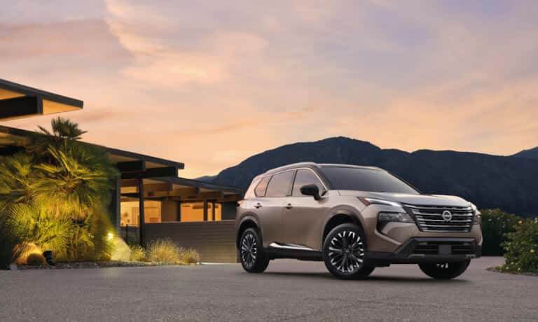 2025 Nissan Rogue parked outside a home