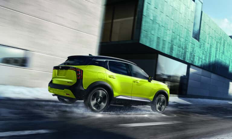 2025 Nissan Kicks driving on snowy road