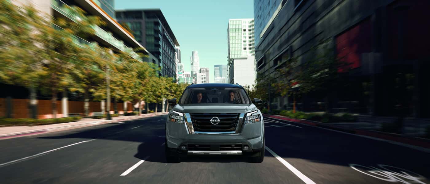 2025 Nissan Pathfinder driving head-on in city