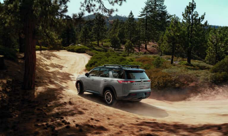 2025 Nissan Pathfinder offroading on dirt trail