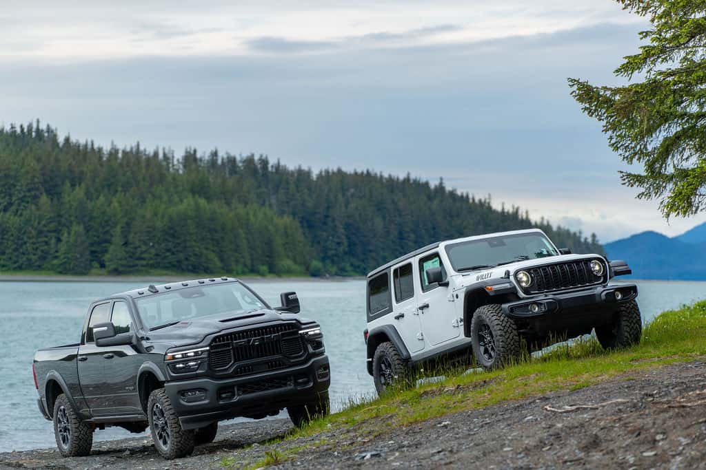 Ram truck and Jeep Wrangler parked by the water in Southeast Alaska