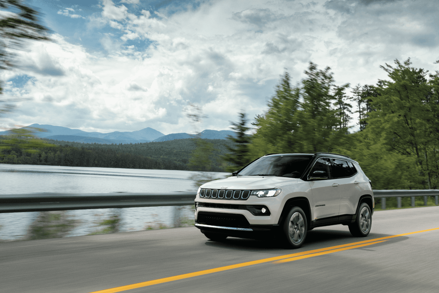 Jeep Compass driving near Juneau Alaska on a scenic road