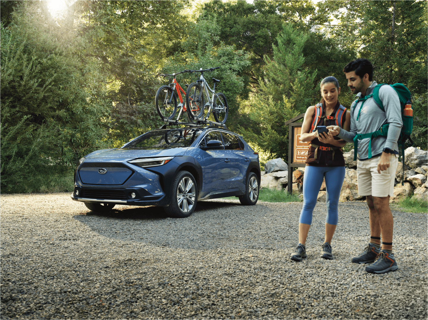 Subaru Solterra EV at a trailhead with bikes on the roof, Southeast Alaska adventure ready