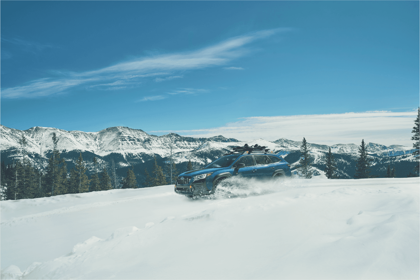 2025 Subaru Outback Wilderness climbing a snowy hill in Alaska
