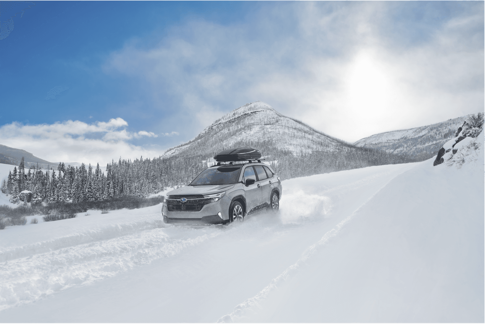 Subaru Forester driving a snowy mountain road like winter above Haines