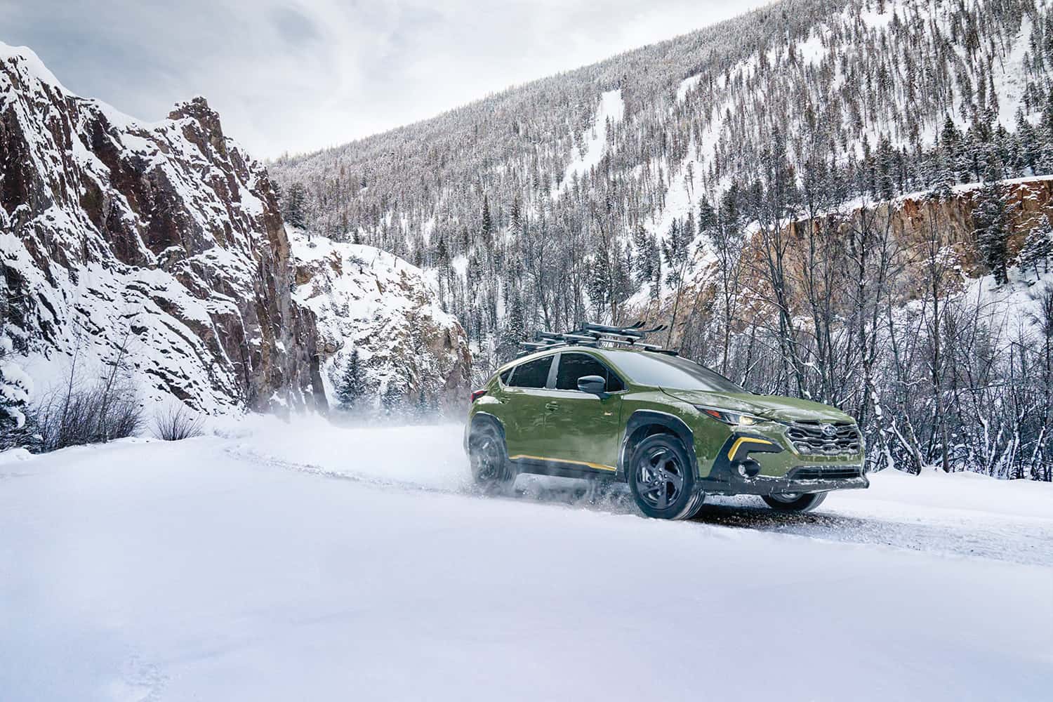 Subaru crossover showing traction on snowy mountain roads in Juneau