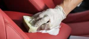 man detailing car console