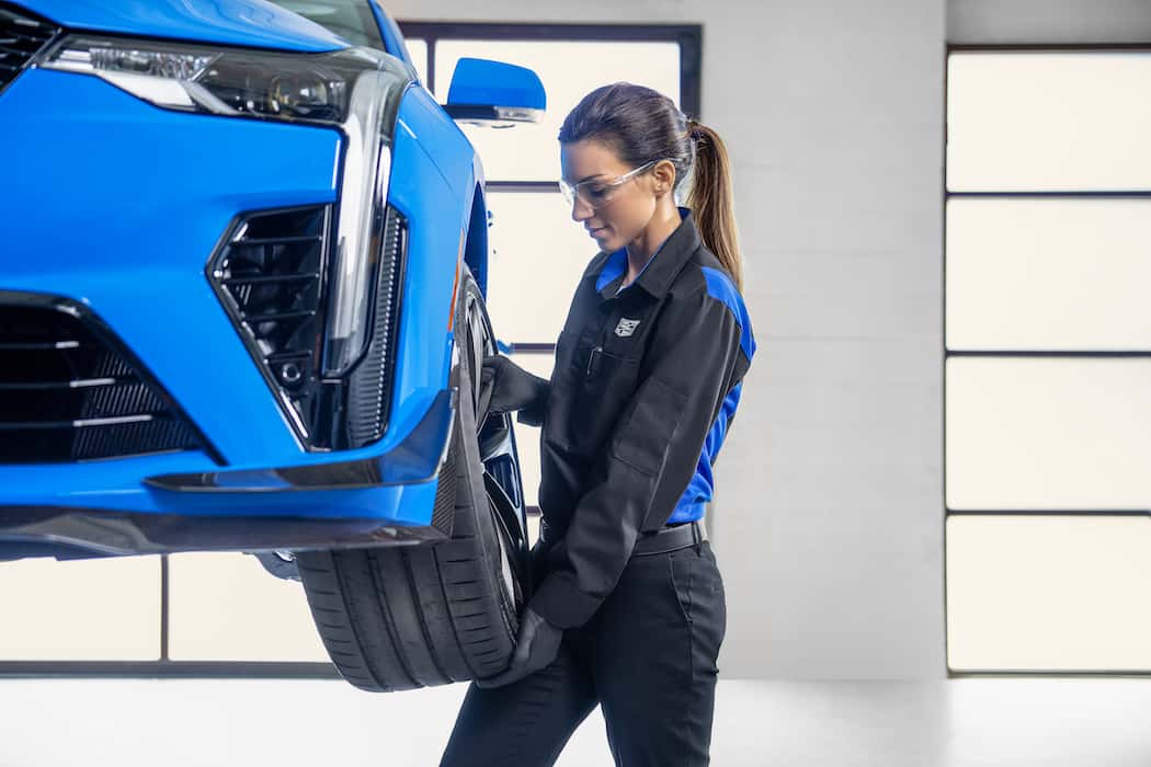 Certified Service Cadillac Certified Service; CT4 Blackwing women changing tire Wheel