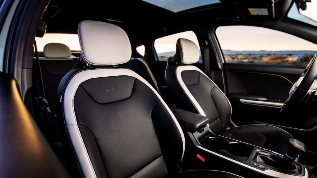 2025 Kia K4 front seats with black and white leather upholstery and sporty styling