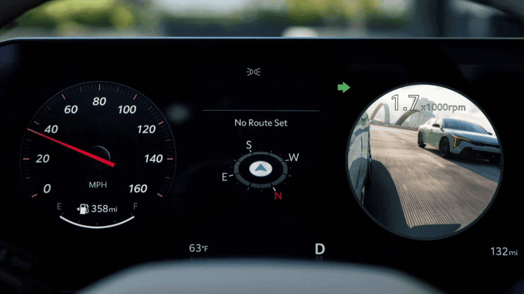 2025 Kia K4 digital instrument cluster showing a real-time side mirror camera feed