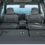 Cargo area of a 2026 GMC Acadia with second and third-row seats folded flat.