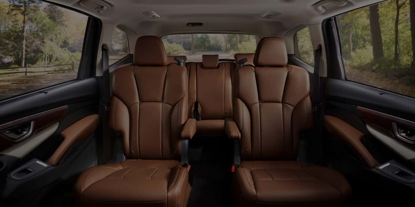 Wide view of the backseat and 3rd row seat of Subaru vehicle.