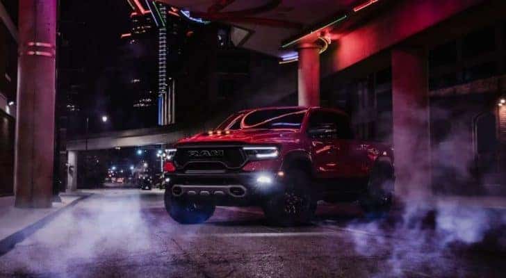 A red 2024 Ram 1500 TRX is shown after leaving a Ram dealer.